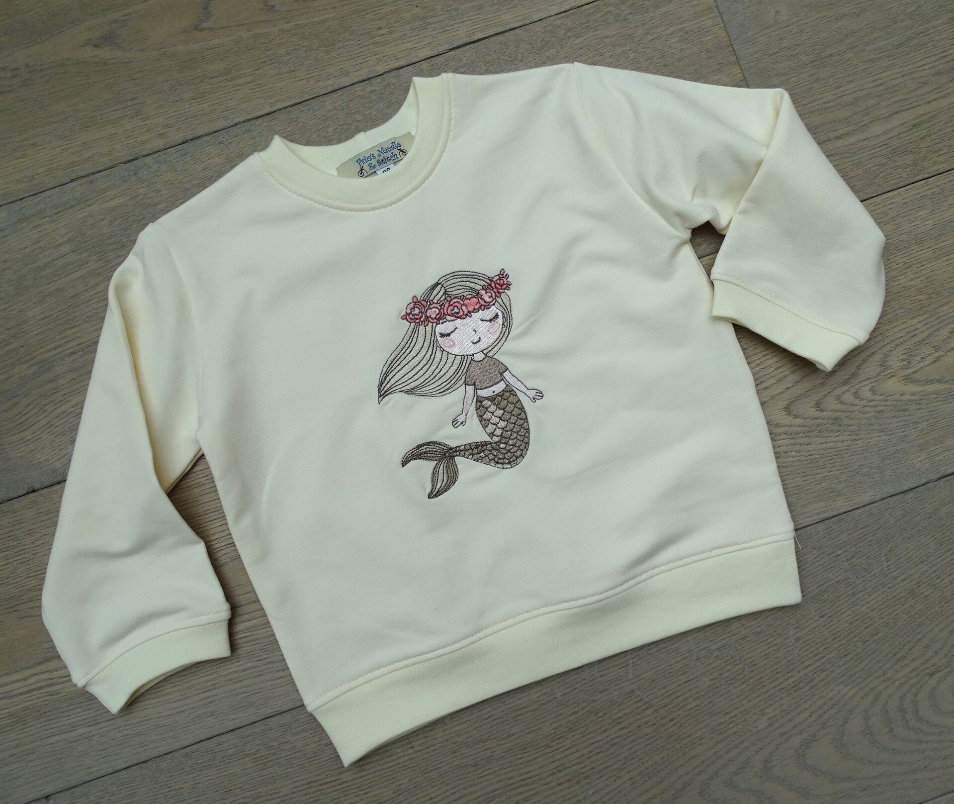 sweater uni ecru borduur zeemeermin