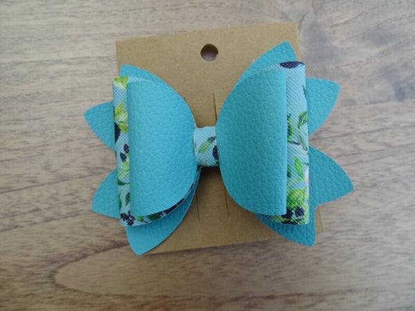 Haarspeld strik turquoiseblauw/bloemen