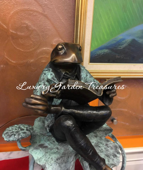 Bronze Frog Sitting Reading on Lily Pad