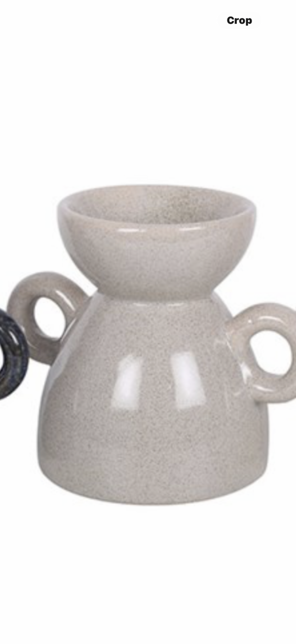 Grey handled wax melter.