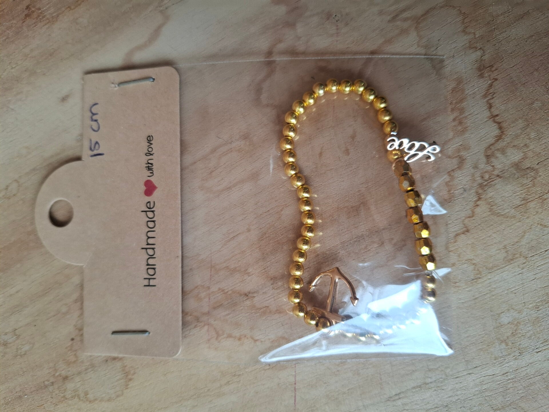 Gouden armbandje met bedels
