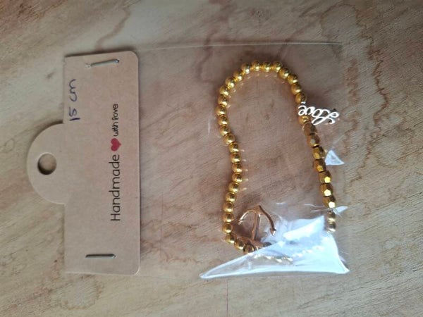 Gouden armbandje met bedels