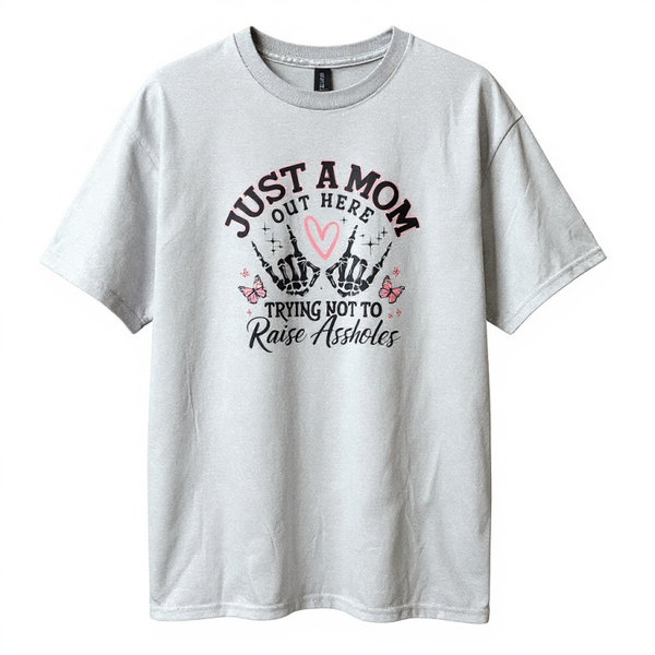 Just A Mom Out Here Trying Not To Raise Assholes Unisex Tee