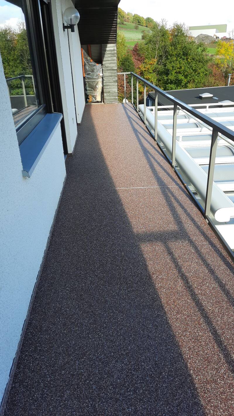 Balkon  Steinteppich Quarzkiesboden fugenlos