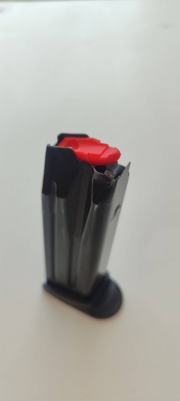 RETENEDOR DE CARGADOR