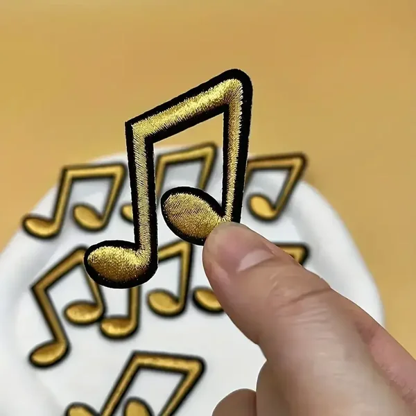 Glitter en Grime Embleem Muzieknoot