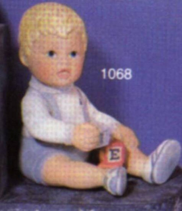 Babyjongen met blokjes