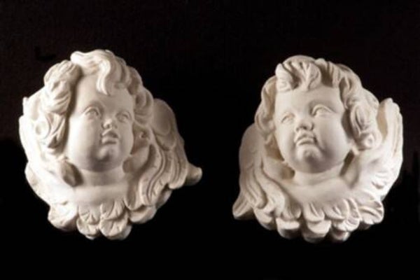 2 têtes d'anges ailées