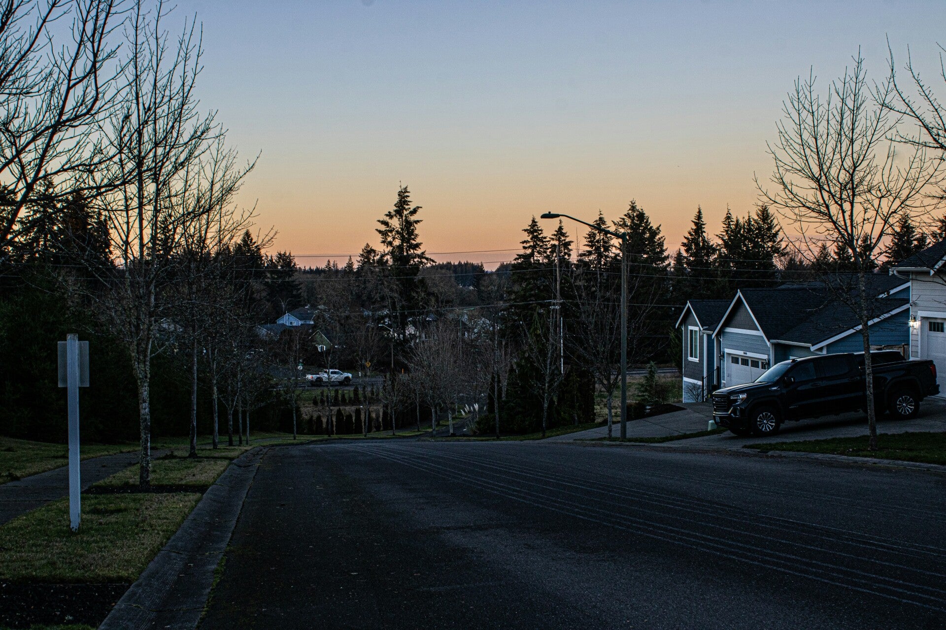 A quiet residential street representing the community and neighbors who helped provide security footage.