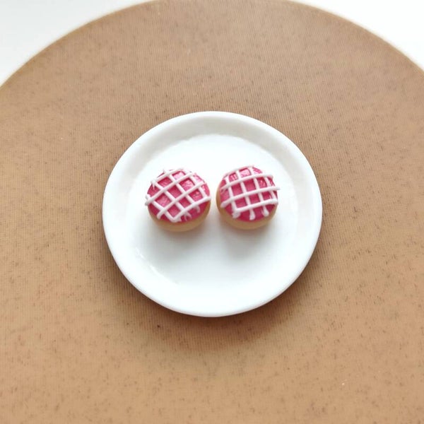 Roze koeken met witte icing