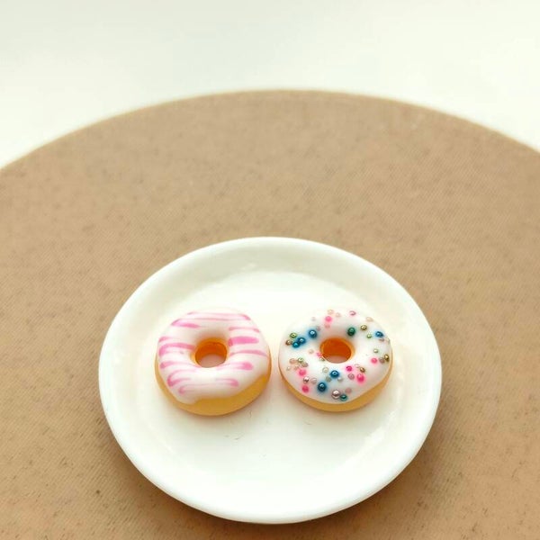 Donuts wit disco en roze swirl