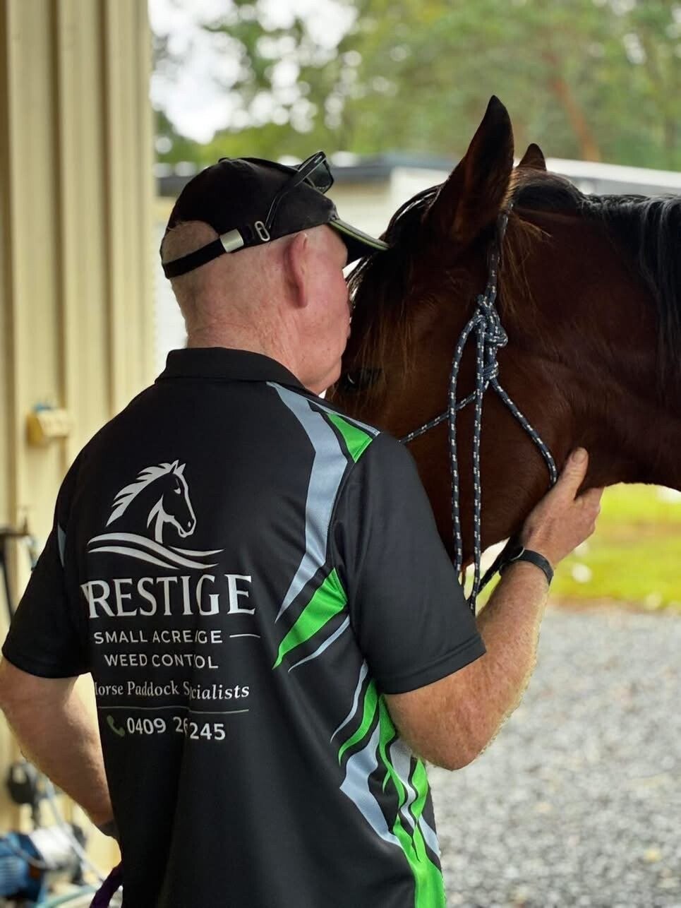 Dave from Prestige Small Acreage Weed Control with his arm around a horse