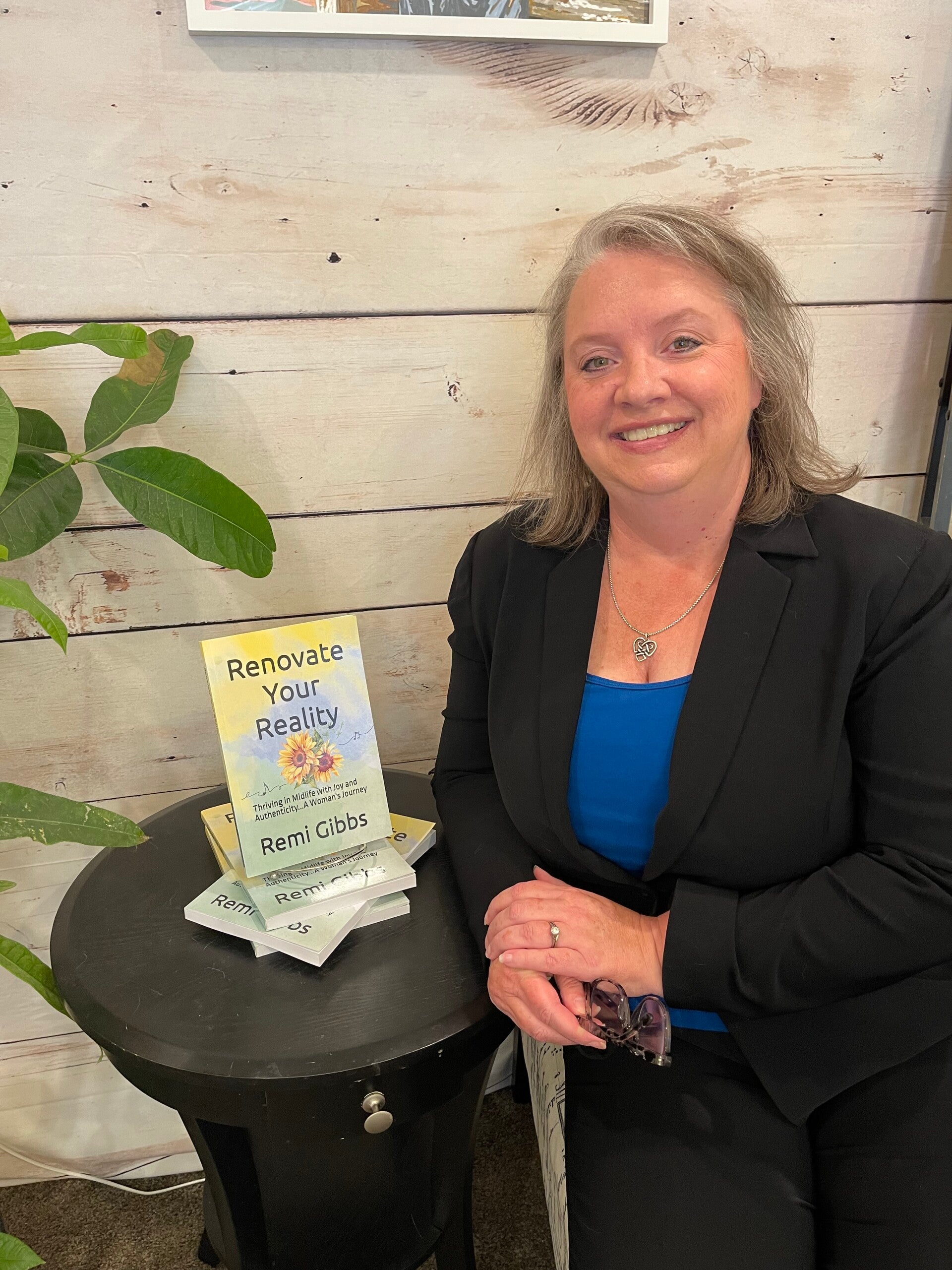 Remi with book-Renovate Your Reality