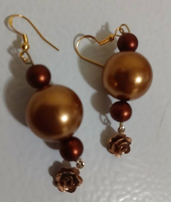 Dangle: Rare copper flower in gold