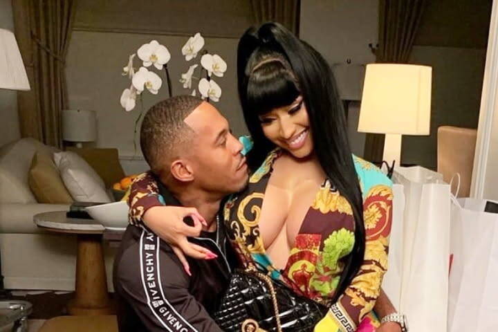 Nicki minaj and Kenneth Petty smiling as a happy couple.