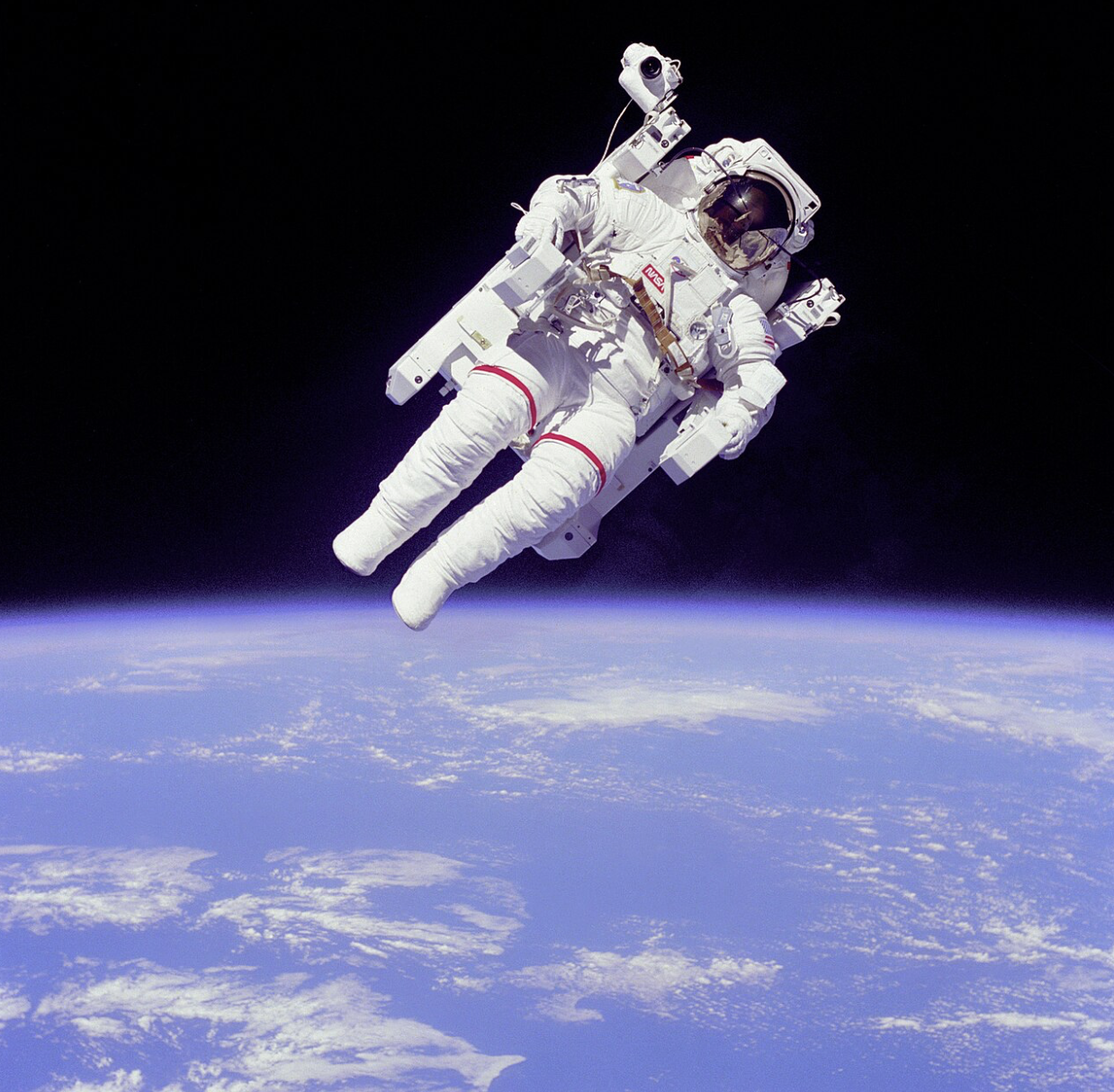 Astronaut Bruce McCandless uses a Manned Maneuvering Unit during a 1984 NASA mission. This device illustrates some important physical principles, such as the conservation of linear and angular momentum, as viewed in Physics tutoring sessions.