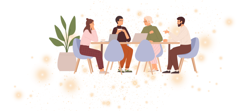 Eine Sitzgruppe an einem länglichen Tisch. Es sind 4 Personen anwesend, zwei Stühle stehen frei. Es sind 3 Frauen und ein Mann, die sich angeregt zu unterhalten scheinen. Ein Laptop steht auf dem Tisch. Ein Person grübelt, eine hat eine Kaffeetasse in der