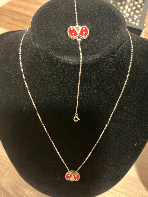 CADENA CON COTORRITA 14 K CON MANILLA REGULABLE