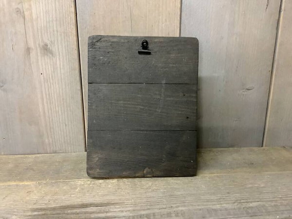 Houten plankje met knijpertje staand