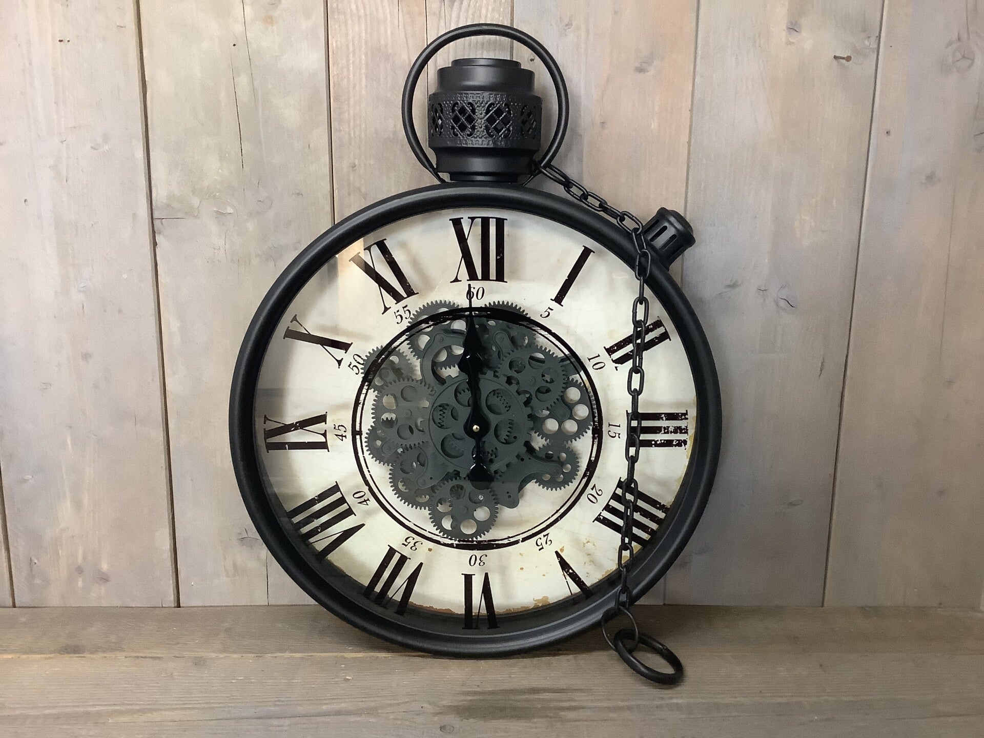 Radarklok zwart met ketting en draaiende radars