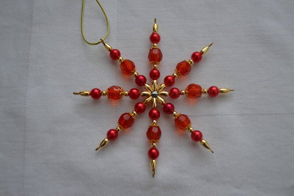 Perlenstern "rot / gold"   cs1048