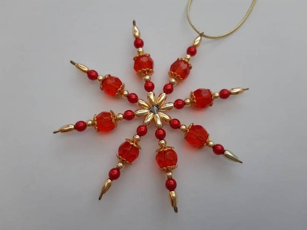 Perlenstern "rot / gold"   cs2711