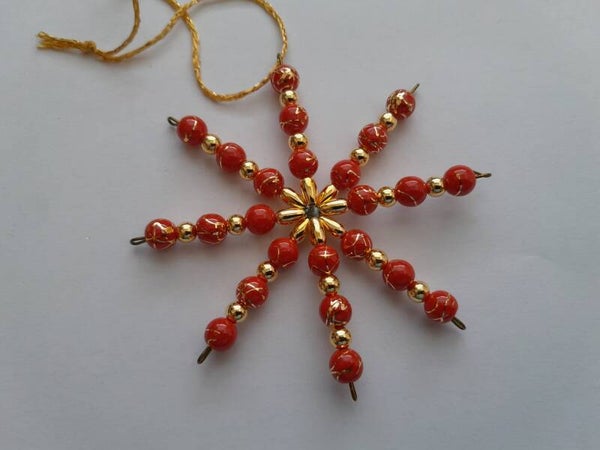 Perlenstern "rot gold"   cs690