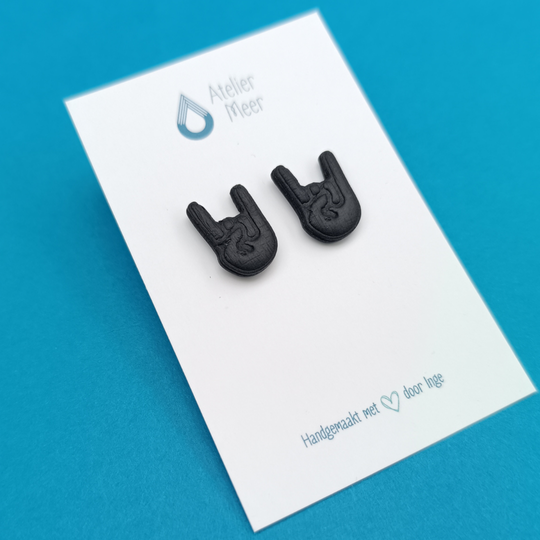 Zwarte Graspop oorstekers | metal rock hand studs