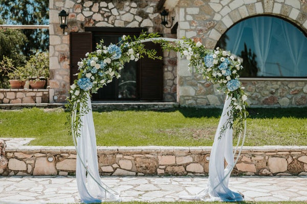 Wedding round arch with 2 fresh flower arrangements