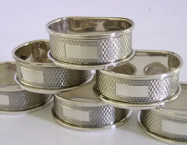 SIX ENGLISH SOLID STERLING SILVER ENGINE TURNED NAPKIN RINGS 1956