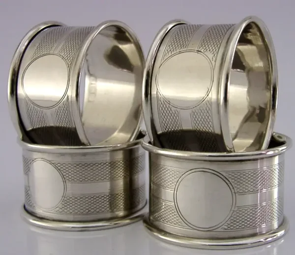 FOUR ENGLISH SOLID STERLING SILVER ENGINE TURNED NAPKIN RINGS 1921 ART DECO