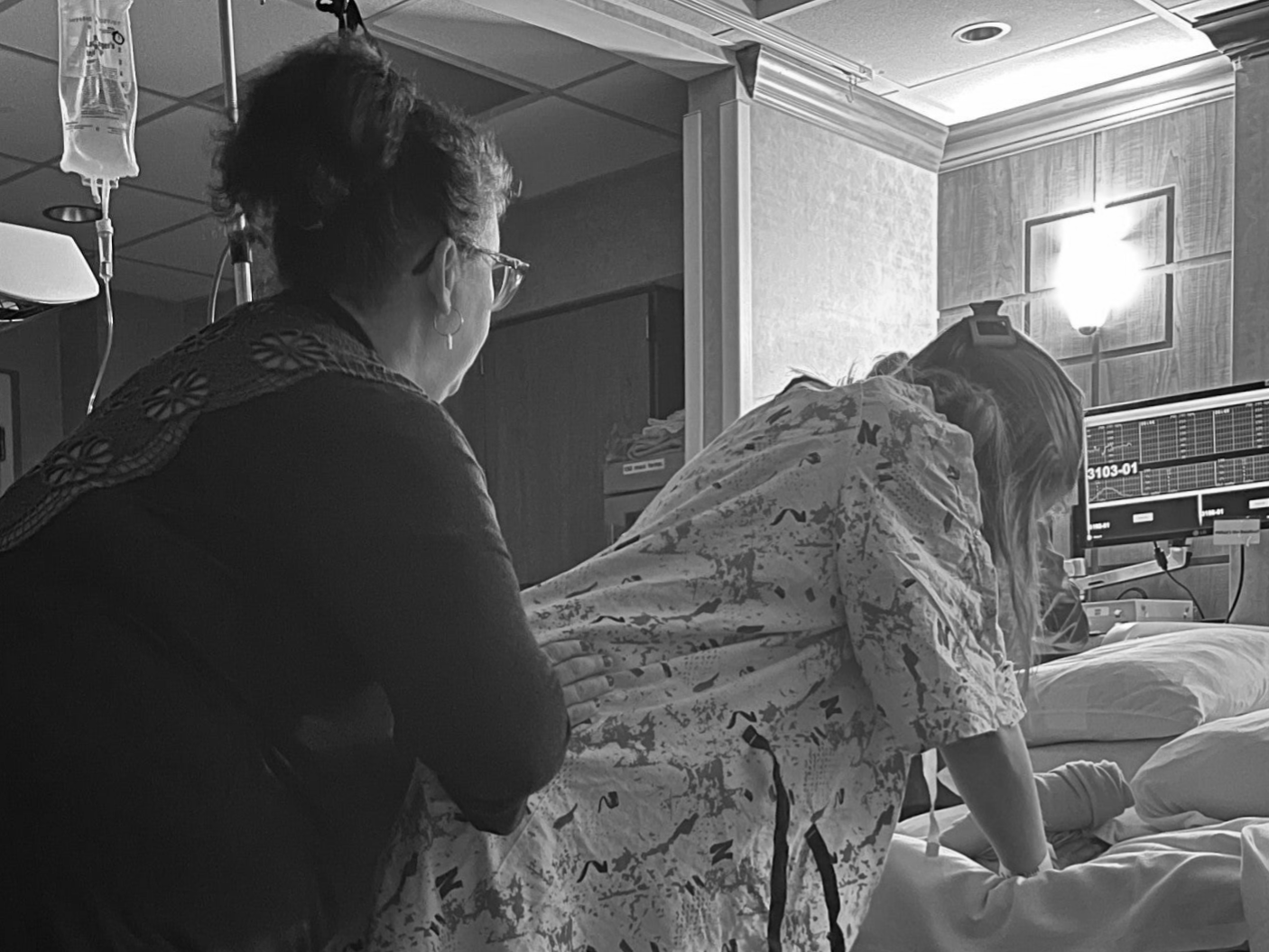 A doula providing hands on comfort measures.
