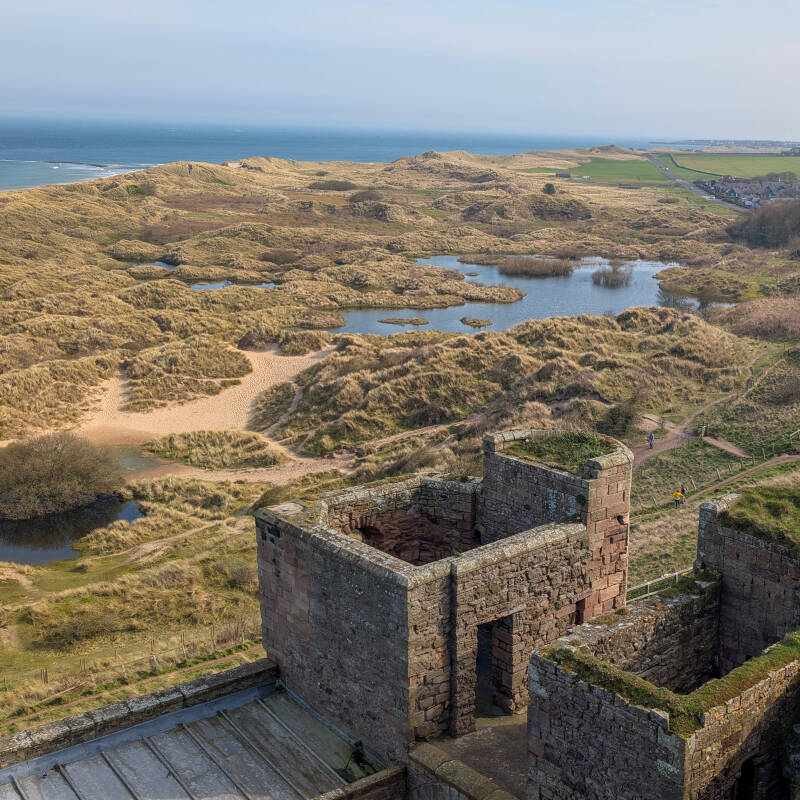 View across the dunes and pools behind Bamburgh Beach from Bamburgh Castle