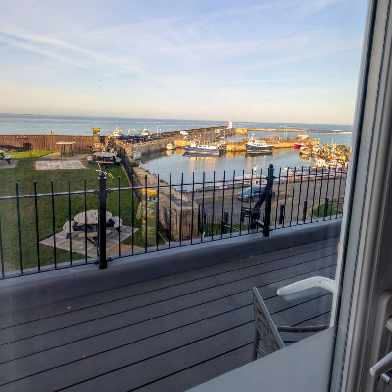View over Seahouses Harbour from a balcony room at The Bamburgh Castle Inn