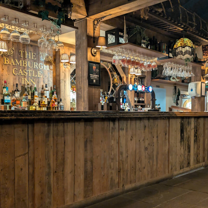 Wooden bar inside The Bamburgh Castle Inn in Seahouses