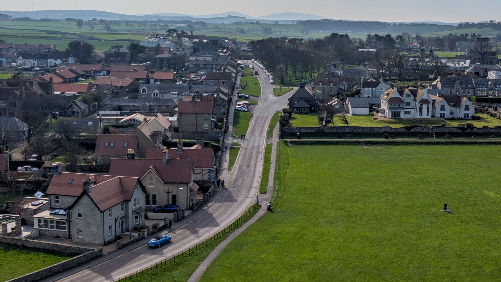 View across Bamburgh Green and the village from Bamburgh Castle