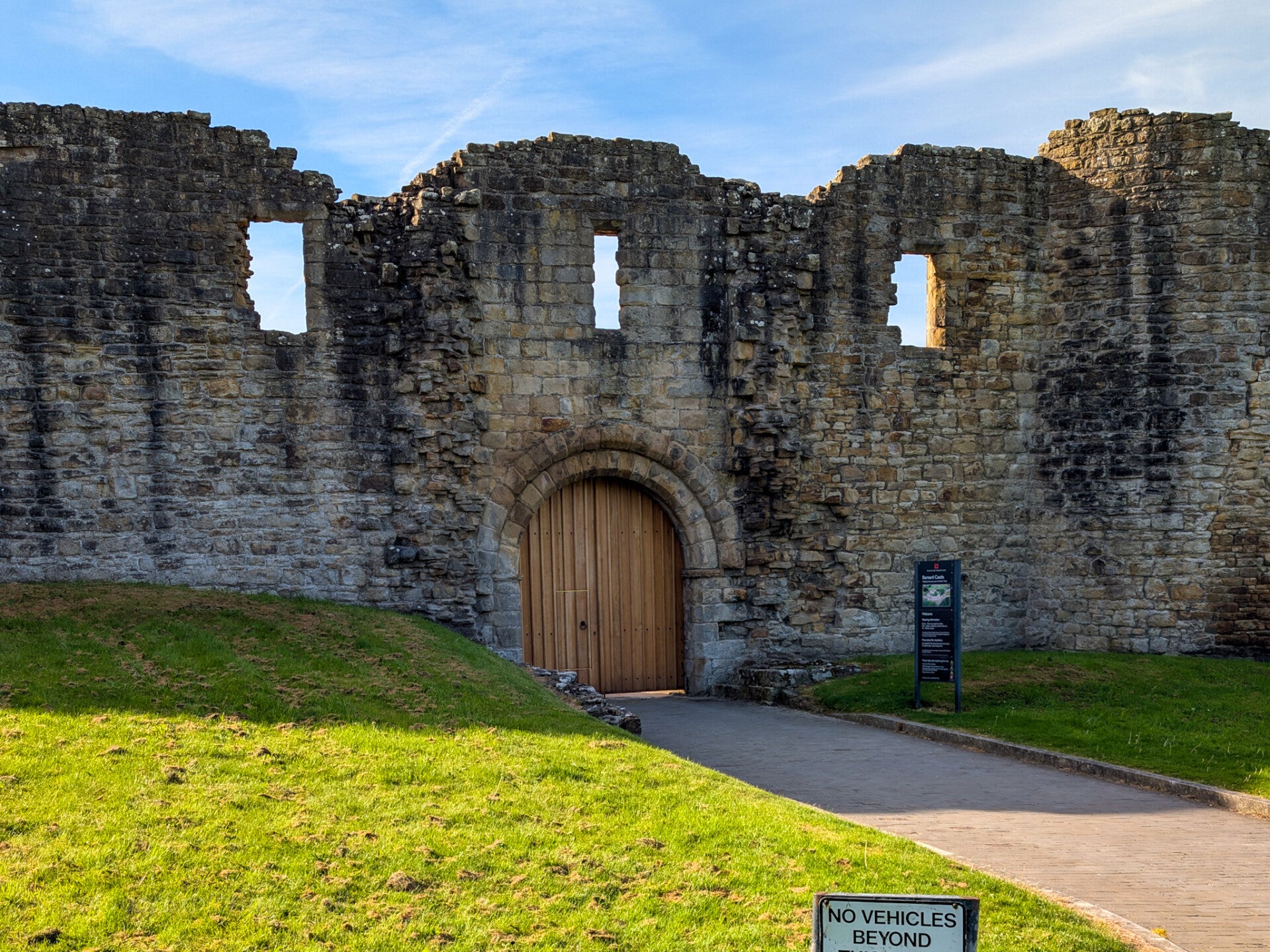 Barnard Castle entrance and medieval castle ruins beside Scar Top in Barnard Castle, County Durham
