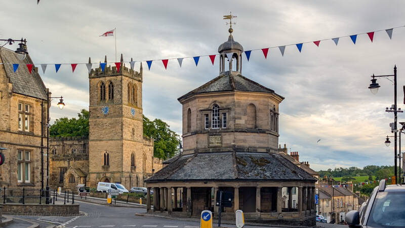 Barnard Castle Market Cross and weather vane, linked with the old local tale of the Market Cross bullet holes.