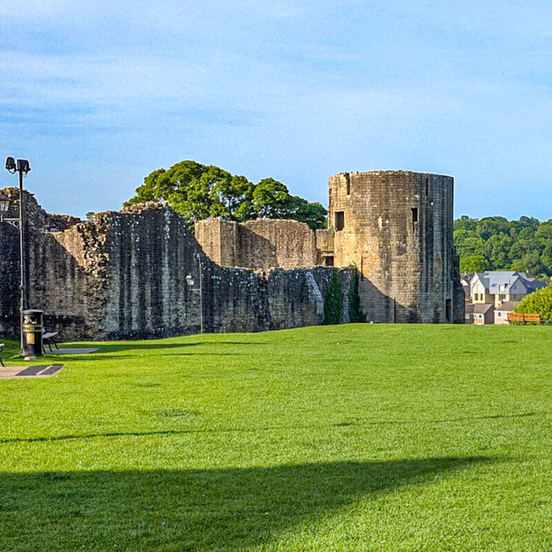 Barnard Castle ruins and the Round Tower viewed across the grass at Scar Top in County Durham.
