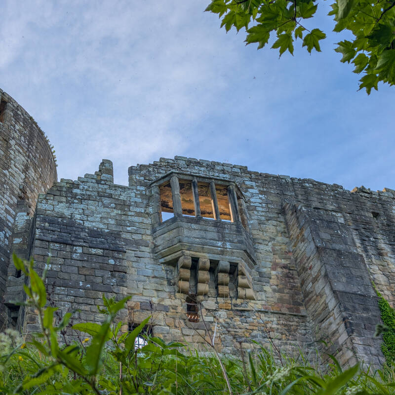 Looking up at a medieval window in Barnard Castle from below the castle walls