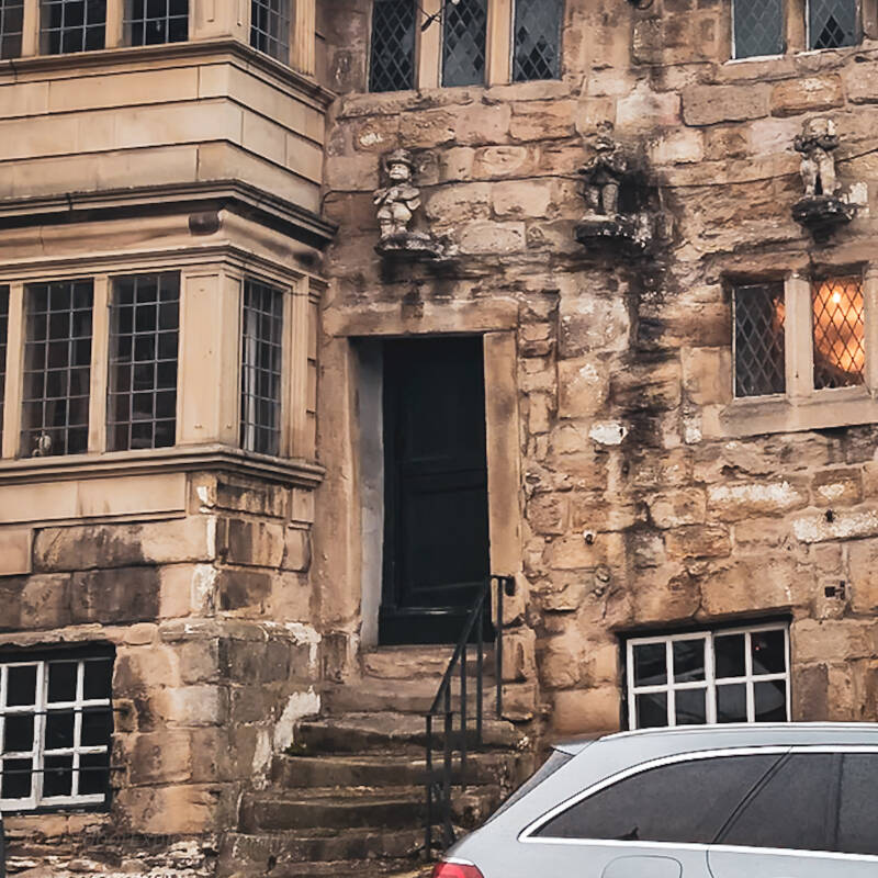 Entrance steps and carved stone figures at the historic Blagraves House in Barnard Castle.