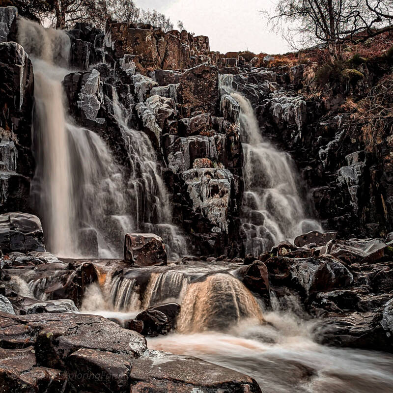 Bleabeck Force waterfall in winter with ice formations on the rocks in Upper Teesdale along the River Tees