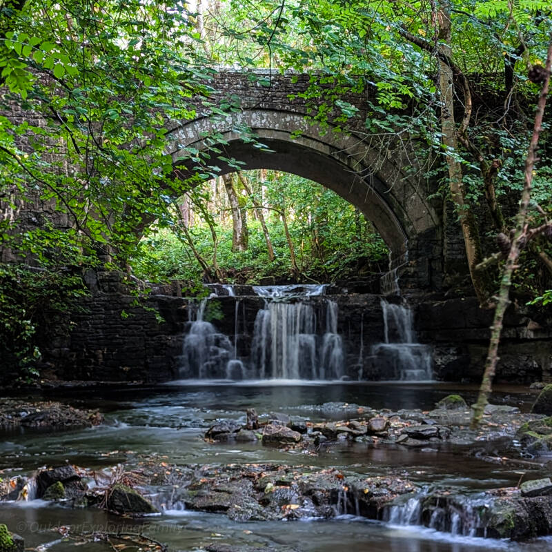 Bow Beck flowing towards the hidden waterfall beneath Bow Lee Bridge at Bowlees Visitor Centre in Teesdale