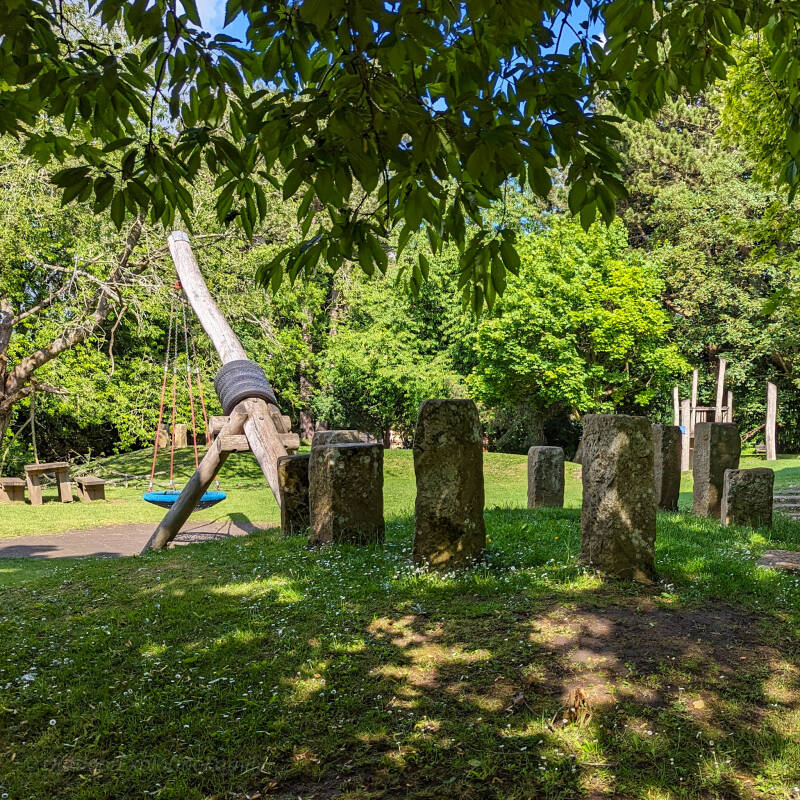 Children’s play area within the peaceful grounds of The Bowes Museum in Barnard Castle surrounded by trees and gardens.
