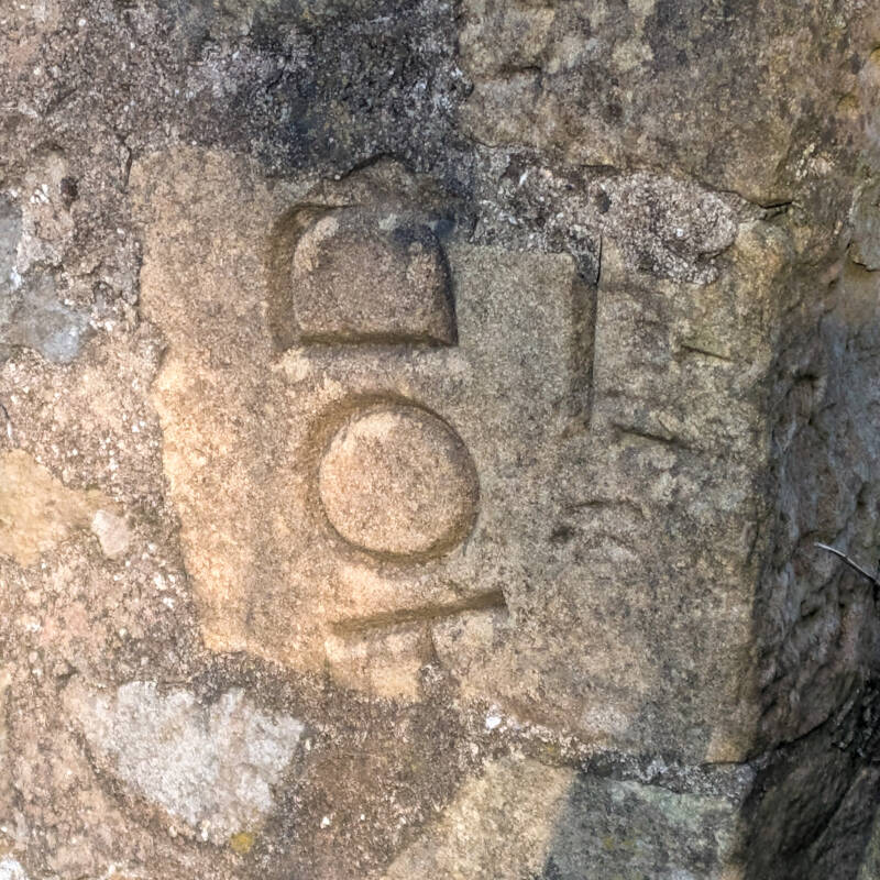 Reused carved stone detail set into wall of Bowlees chapel building in Teesdale