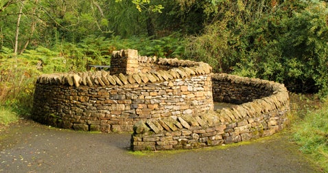 dry-stone wall seat shaped like a snail’s shell
