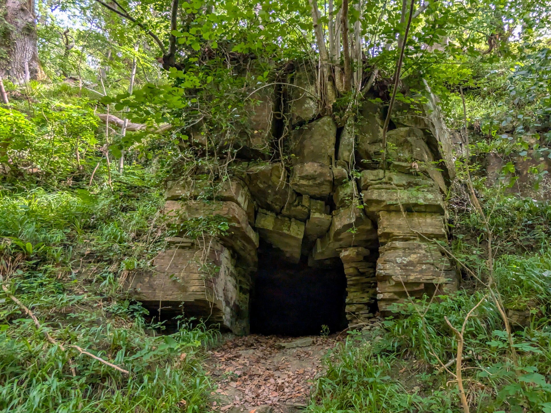 Brignall Banks Cave beside the woodland footpath on the Brignall Banks and Rokeby Circular Walk near Greta Bridge, County Durham.