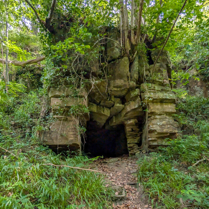 Brignall Banks Cave beside the public footpath beneath sandstone rocks in Brignall Banks woodland.
