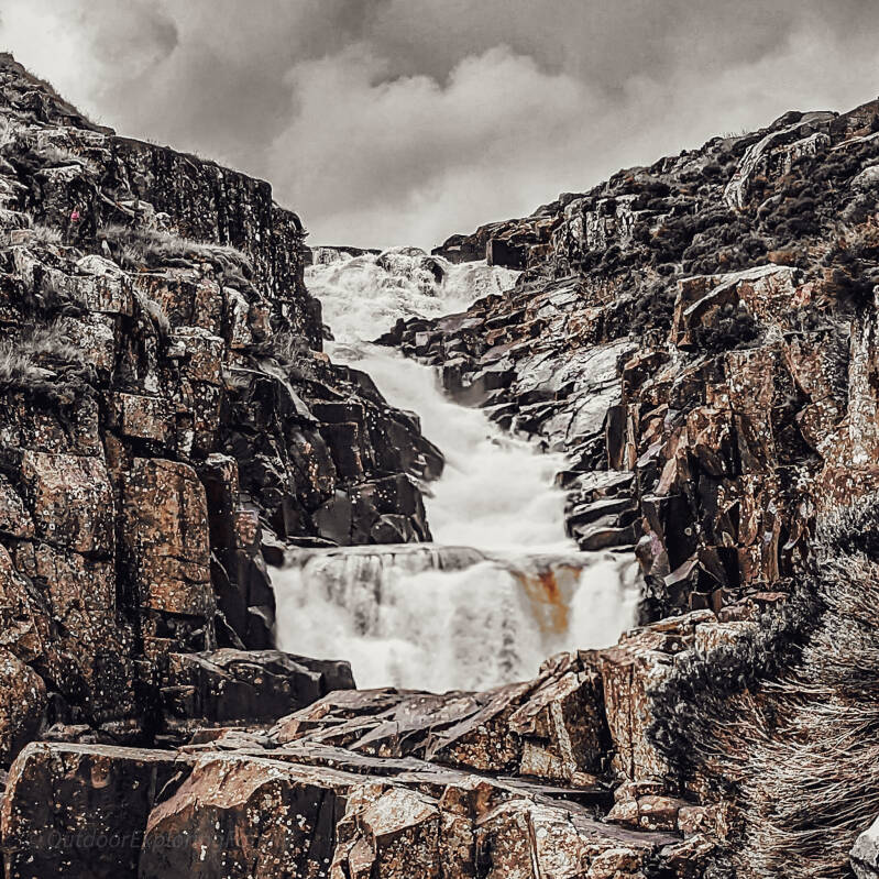 Cauldron Snout waterfall cascading through the Whin Sill gorge in Upper Teesdale.