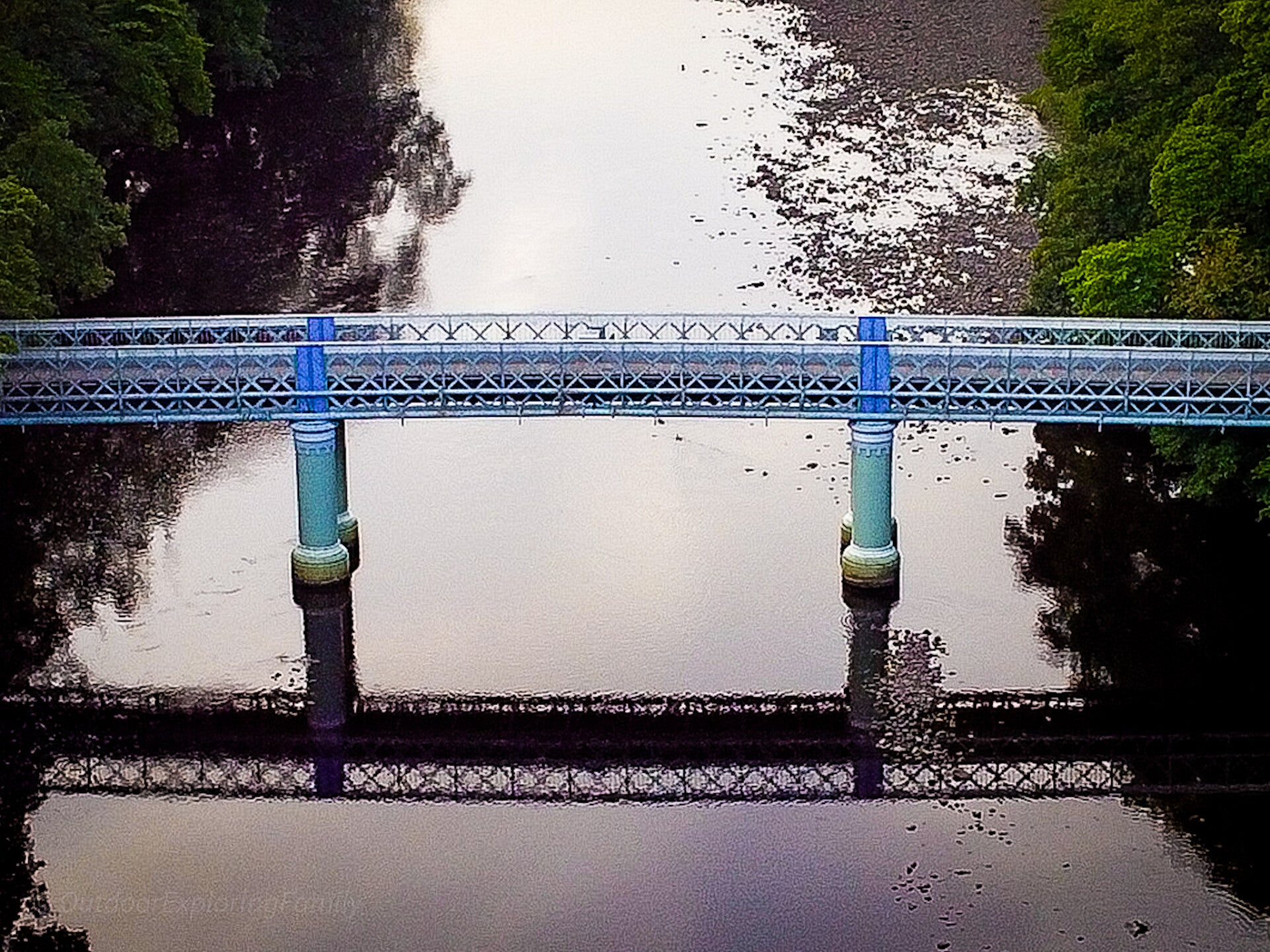 Aerial view of Deepdale Aqueduct crossing the River Tees near Barnard Castle, with woodland and riverside scenery around the bridge.